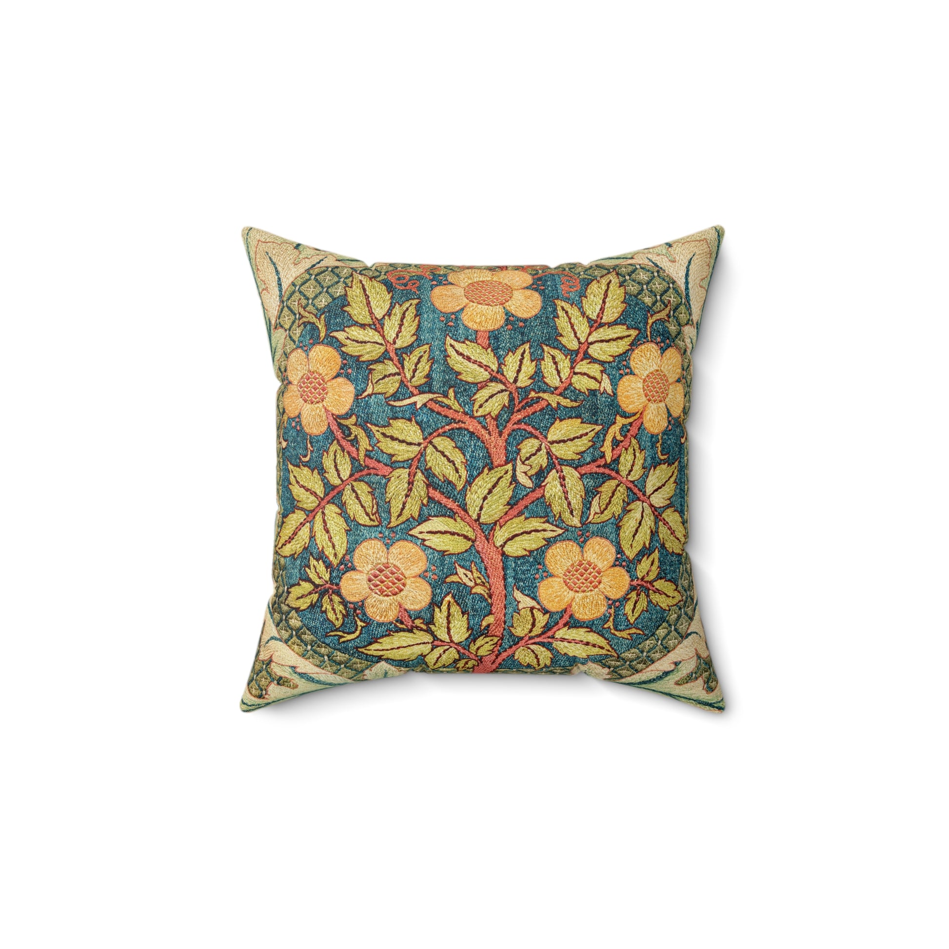 A square faux suede cushion with a William Morris & Co floral design in green, yellow and red.