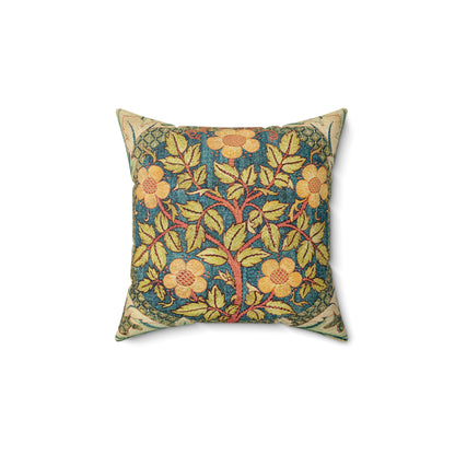 A square faux suede cushion with a William Morris & Co floral design in green, yellow and red.