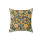 A square faux suede cushion with a floral design in green, yellow, and red.