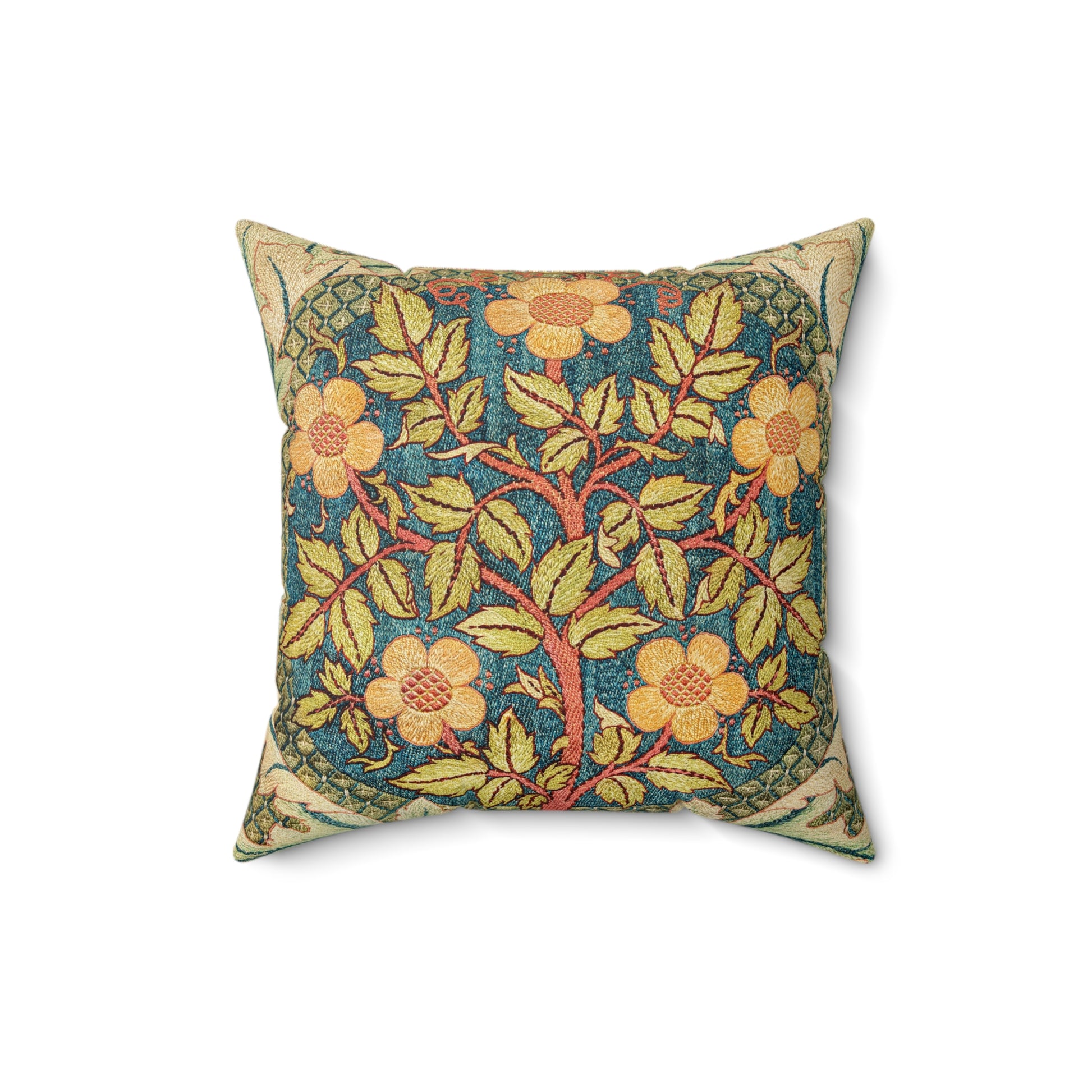 A square faux suede cushion with a floral design in green, yellow, and red.