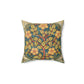 A square faux suede cushion with a William Morris & Co floral design in green, yellow and red.