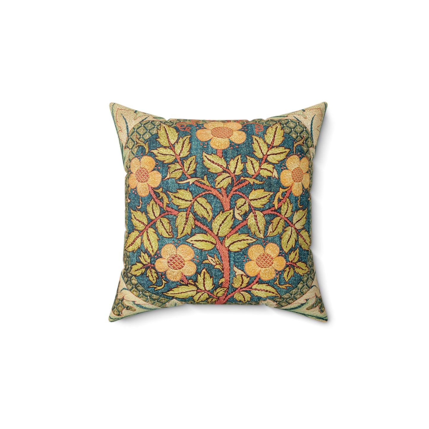 A square faux suede cushion with a William Morris & Co floral design in green, yellow and red.