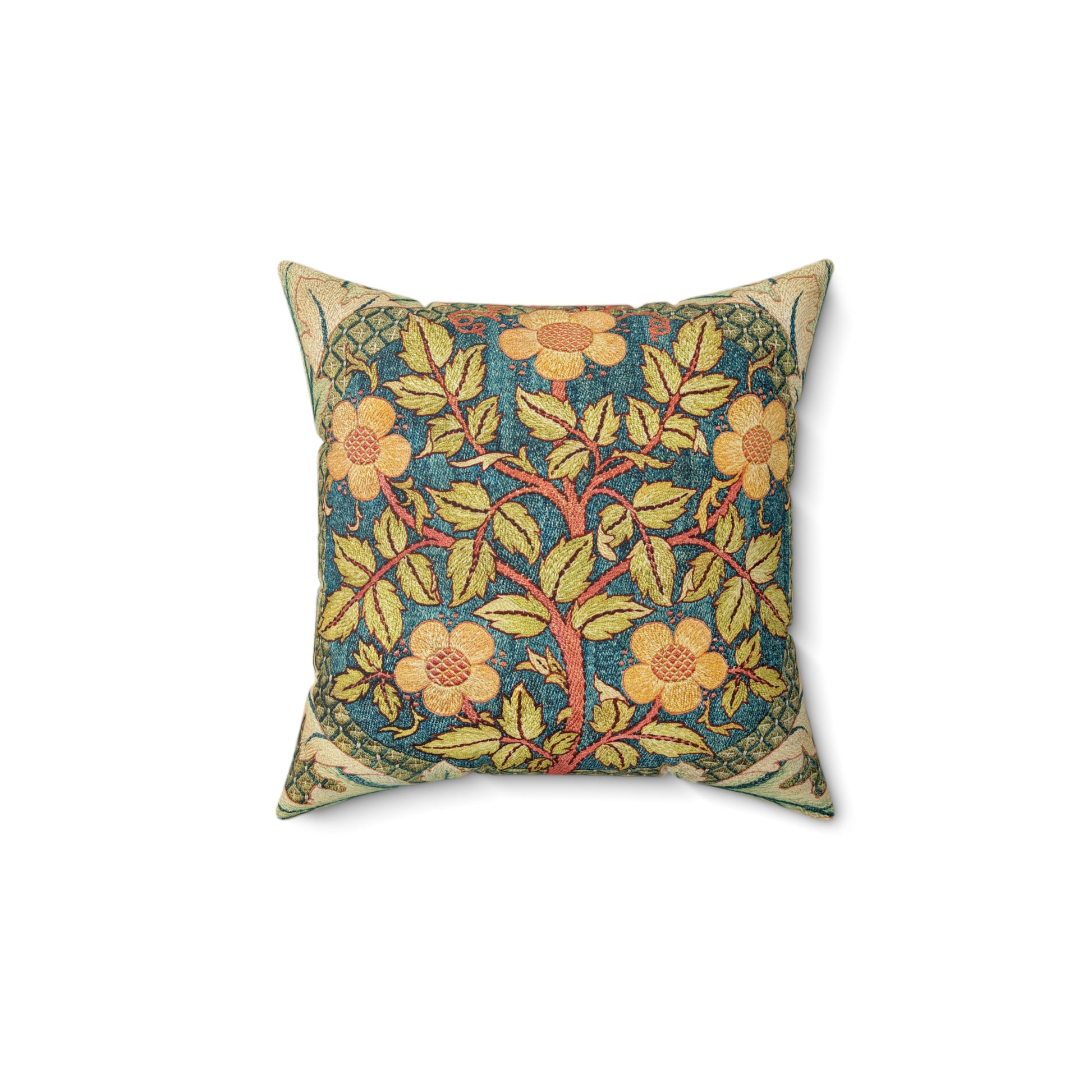 A square faux suede cushion with a William Morris & Co floral design in green, yellow and red.