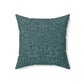 A square-shaped throw pillow with a teal colour, featuring a floral pattern of acorns and oak leaves inspired by William Morris.