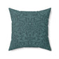 A square-shaped throw pillow with a teal colour, featuring a floral pattern of acorns and oak leaves inspired by William Morris.