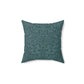 A square-shaped throw pillow with a teal colour, featuring a floral pattern of acorns and oak leaves inspired by William Morris.