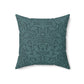 A square-shaped throw pillow with a teal colour, featuring a floral pattern of acorns and oak leaves inspired by William Morris.