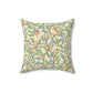 A square-shaped cushion with an all-over William Morris & Co print featuring birds and pomegranate fruits on a beige background.
