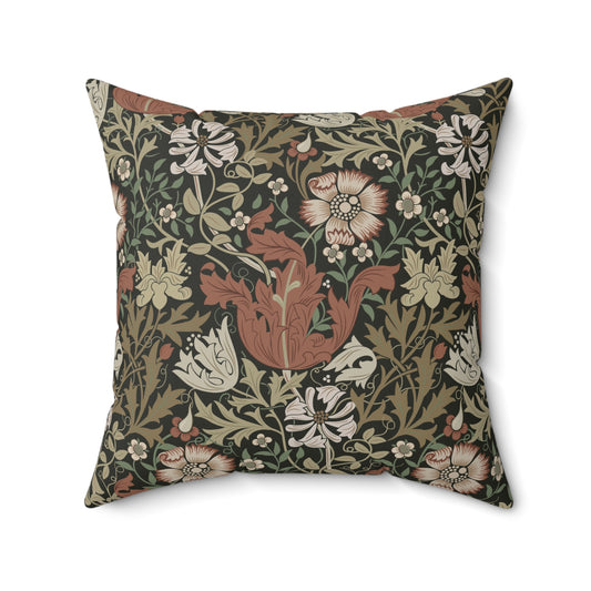 A square faux suede cushion with a floral William Morris & Co pattern in shades of green, brown and beige called Compton