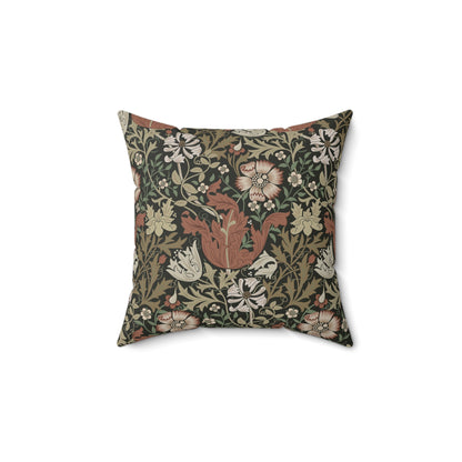 A square faux suede cushion with a floral William Morris & Co pattern in shades of green, brown and beige called Compton
