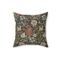 A square faux suede cushion with a floral William Morris & Co pattern in shades of green, brown and beige called Compton