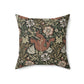 A square faux suede cushion with a floral William Morris & Co pattern in shades of green, brown and beige called Compton