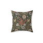 A square faux suede cushion with a floral William Morris & Co pattern in shades of green, brown and beige called Compton