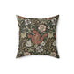 A square faux suede cushion with a floral William Morris & Co pattern in shades of green, brown and beige called Compton