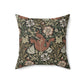 A square faux suede cushion with a floral William Morris & Co pattern in shades of green, brown and beige called Compton