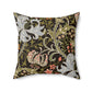 A square-shaped faux suede cushion with a William Morris & Co floral pattern design, predominantly in shades of green, brown and white.