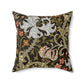 A square-shaped faux suede cushion with a William Morris & Co floral pattern design, predominantly in shades of green, brown and white.