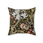 A square-shaped faux suede cushion with a William Morris & Co floral pattern design, predominantly in shades of green, brown and white.