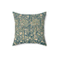A square faux suede cushion with a floral pattern in evergreen teal colors.