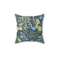 A square faux suede cushion with a blue floral pattern based on the Seaweed Collection design by William Morris & Co.