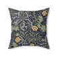 A square faux suede cushion with a yellow flower and seaweed William Morris & Co pattern, predominantly dark in colour.