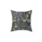 A square faux suede cushion with a yellow flower and seaweed William Morris & Co pattern, predominantly dark in colour.
