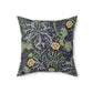 A square faux suede cushion with a yellow flower and seaweed William Morris & Co pattern, predominantly dark in colour.