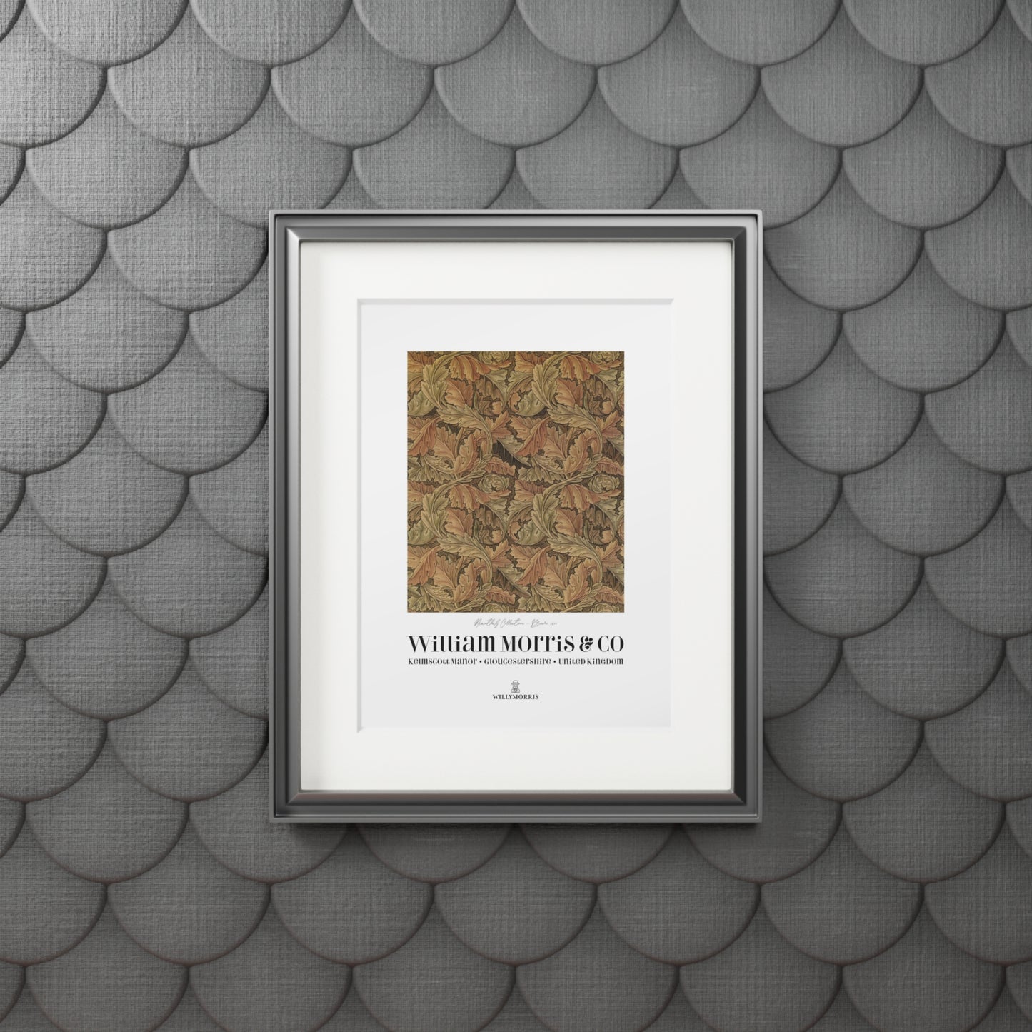Framed artwork with text on a textured gray wall
