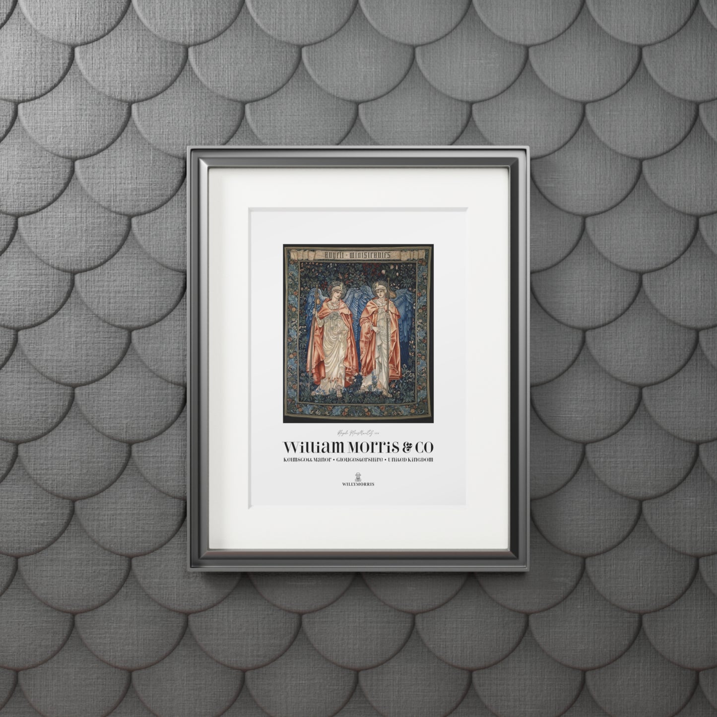 Framed artwork with text on a textured gray wall