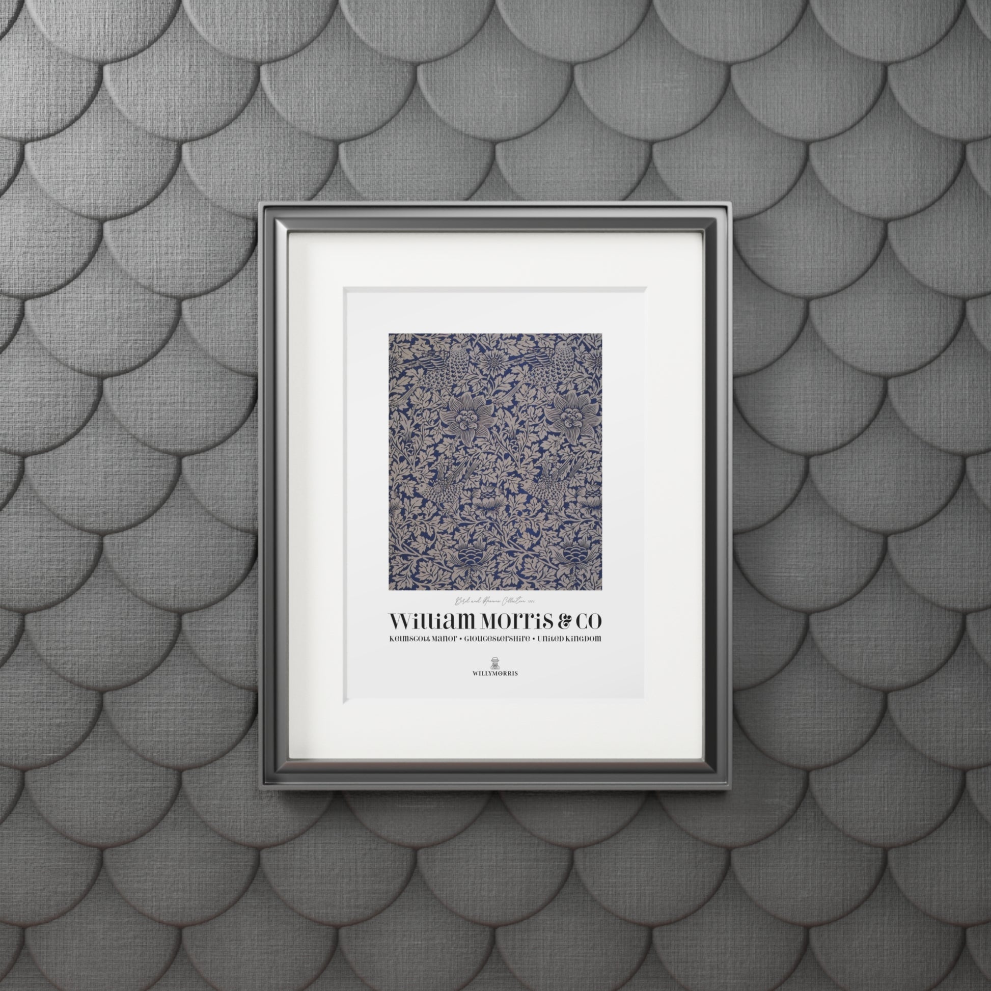 Framed artwork with text on a textured gray wall