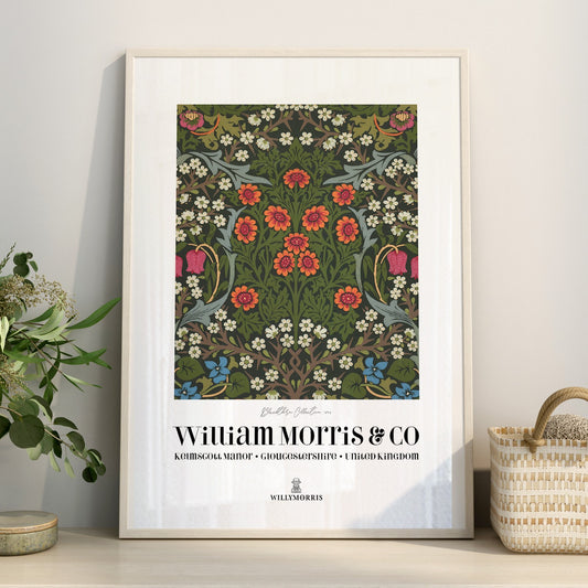 Framed floral pattern poster with 'William Morris & Co' branding on a wall.