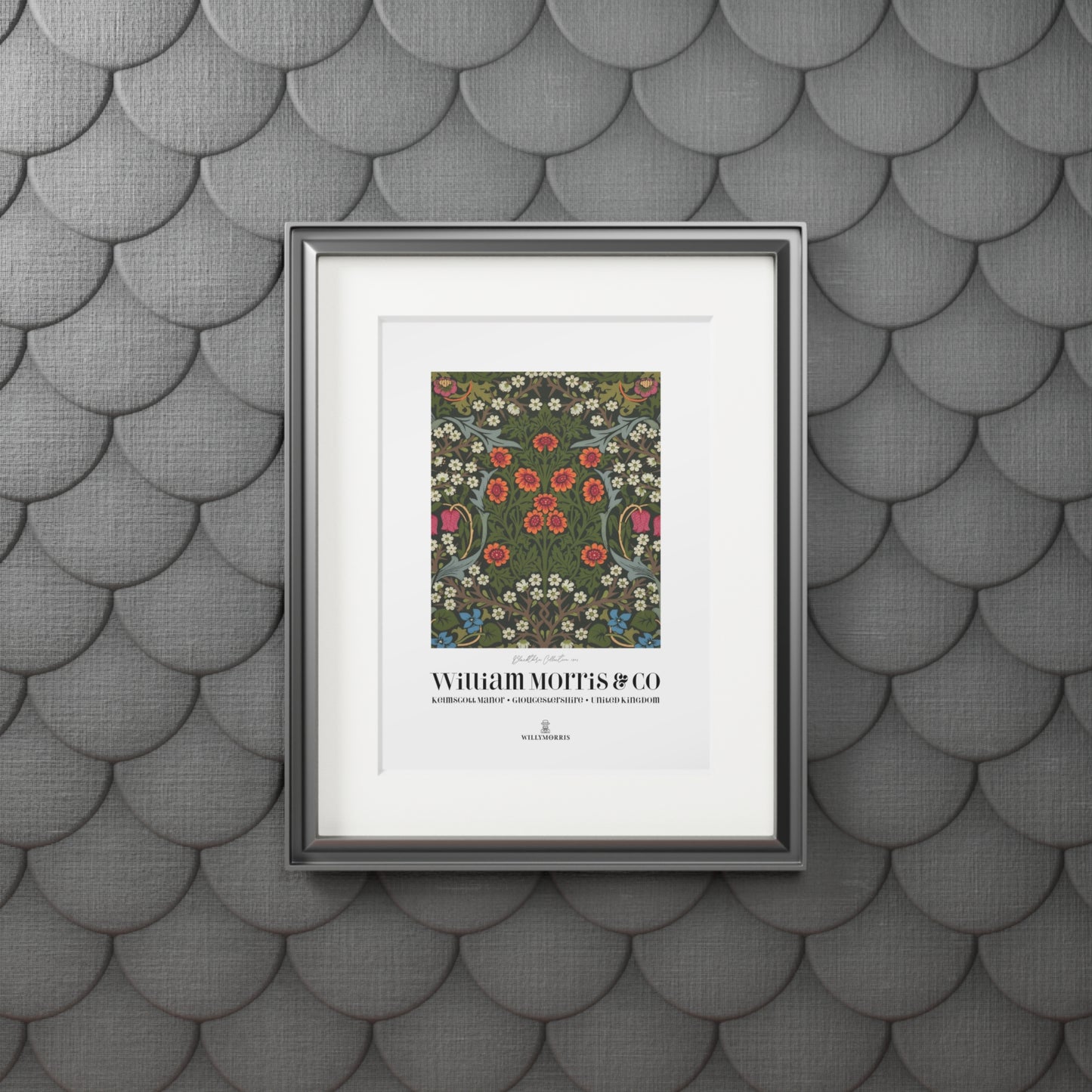 Framed artwork with floral design and text on a textured gray wall