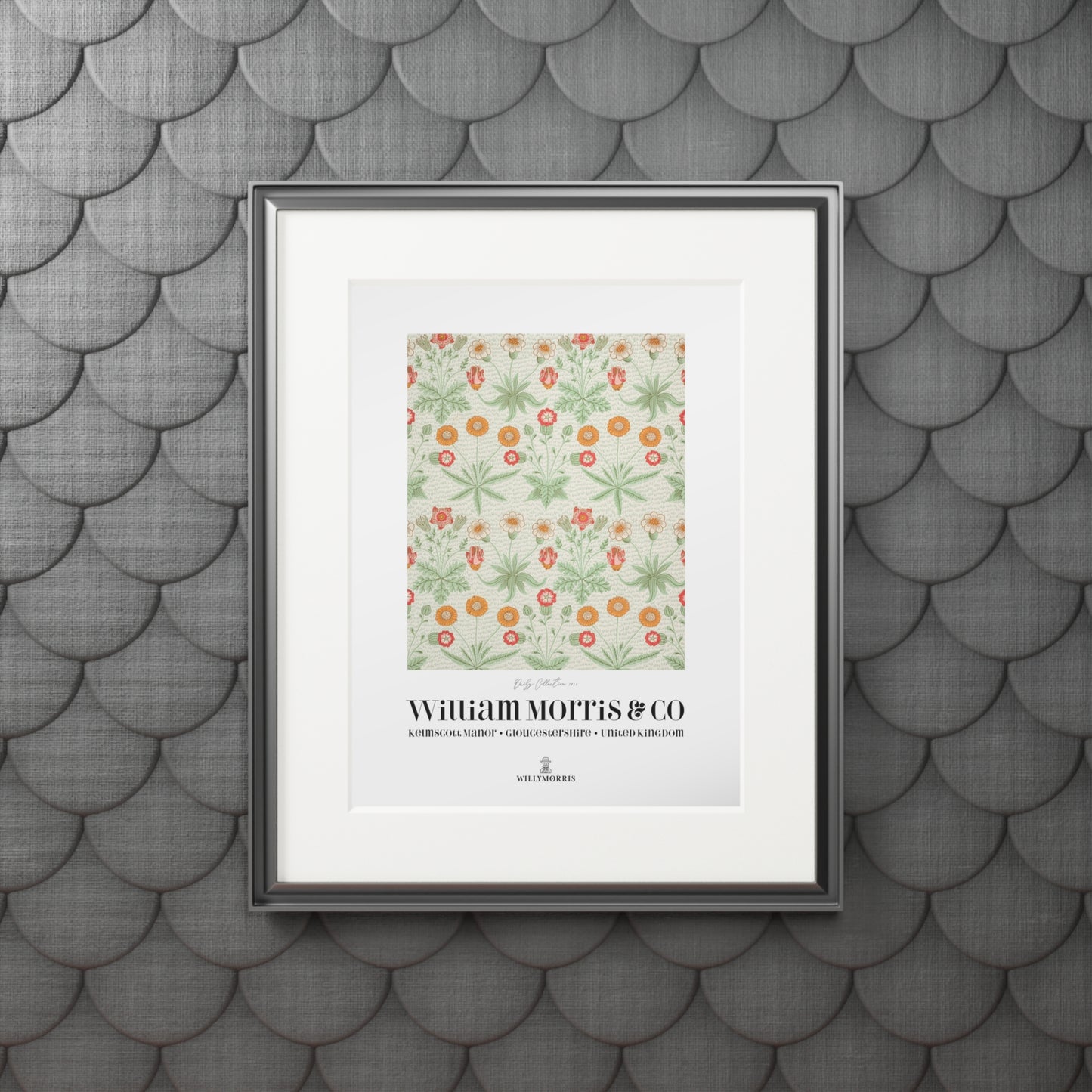 Framed artwork with floral pattern and text on a textured gray wall