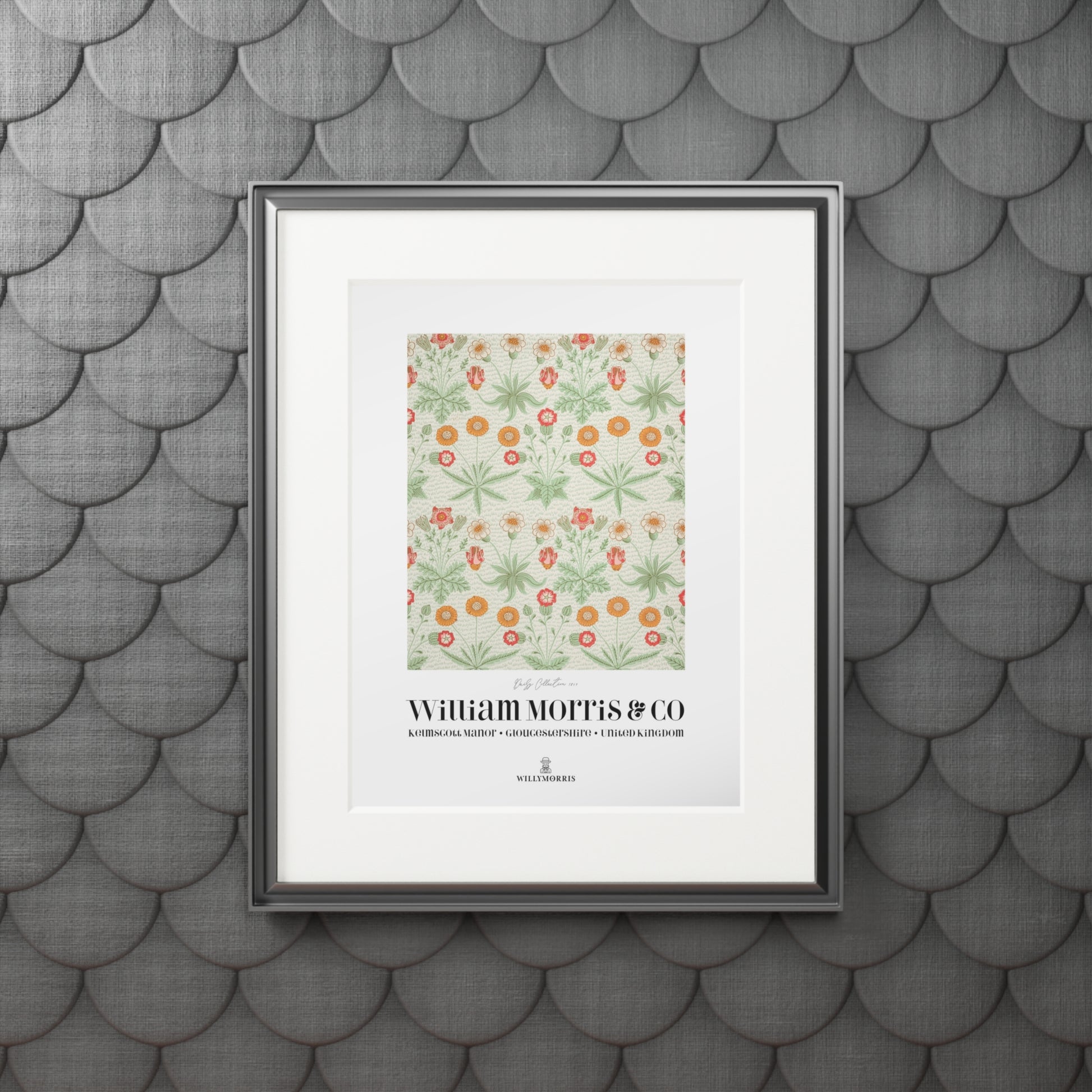 Framed artwork with floral pattern and text on a textured gray wall