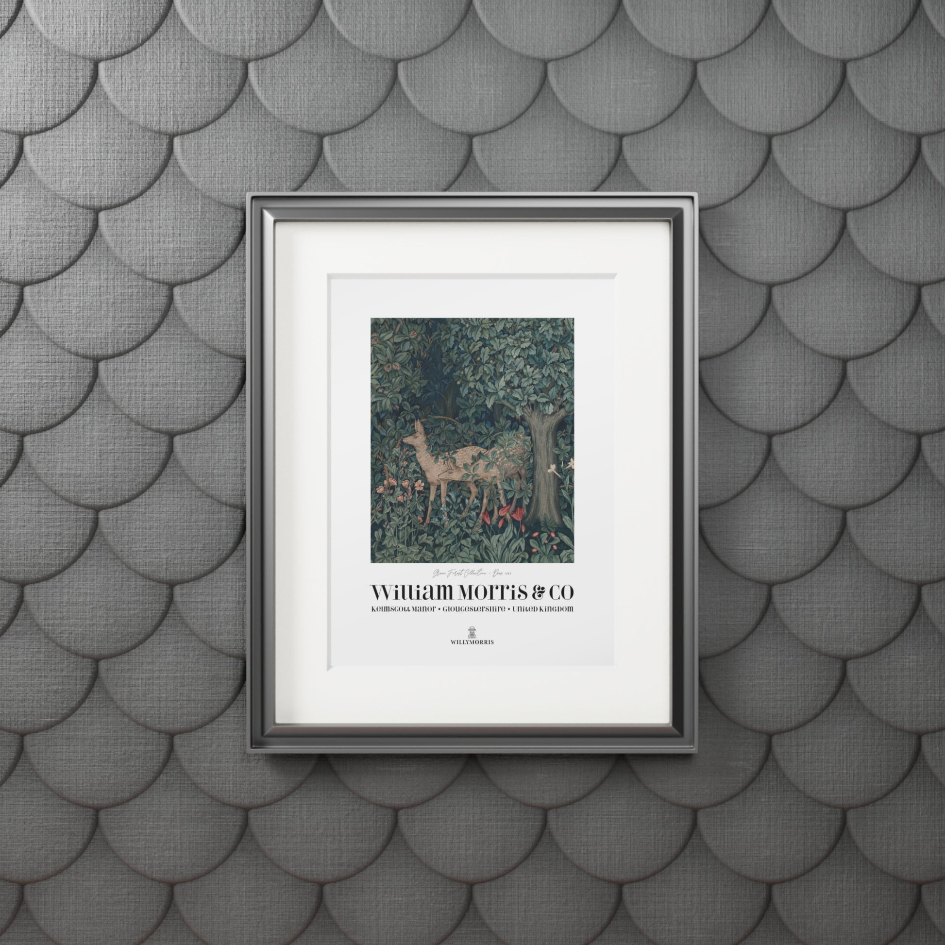 Framed artwork with deer illustration on a textured gray wall