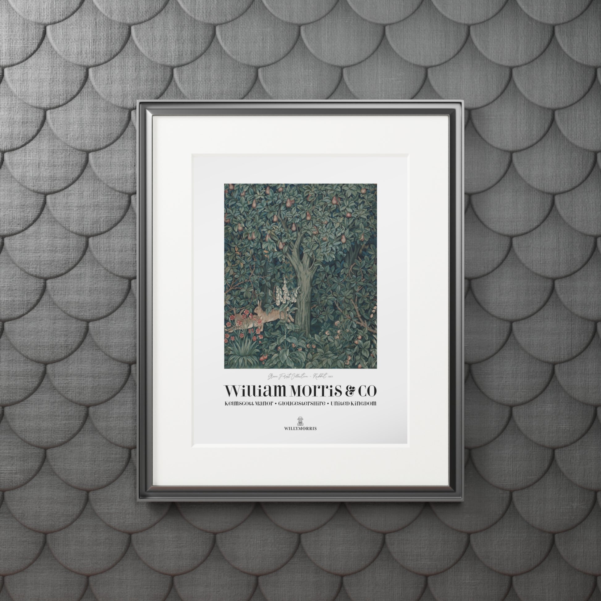Framed artwork with 'William Morris & Co' on a textured gray wall