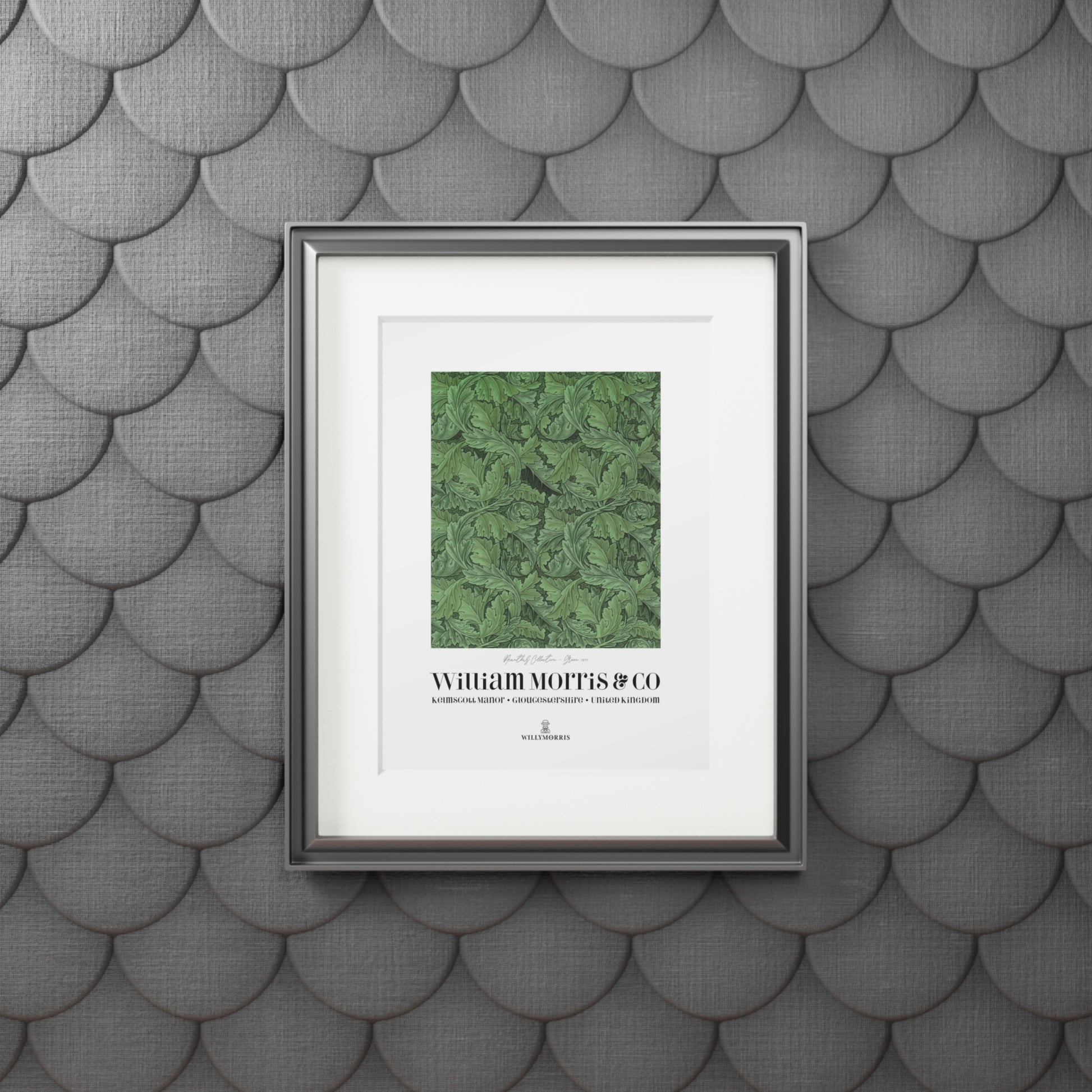 Framed artwork with green pattern and text on a textured gray wall