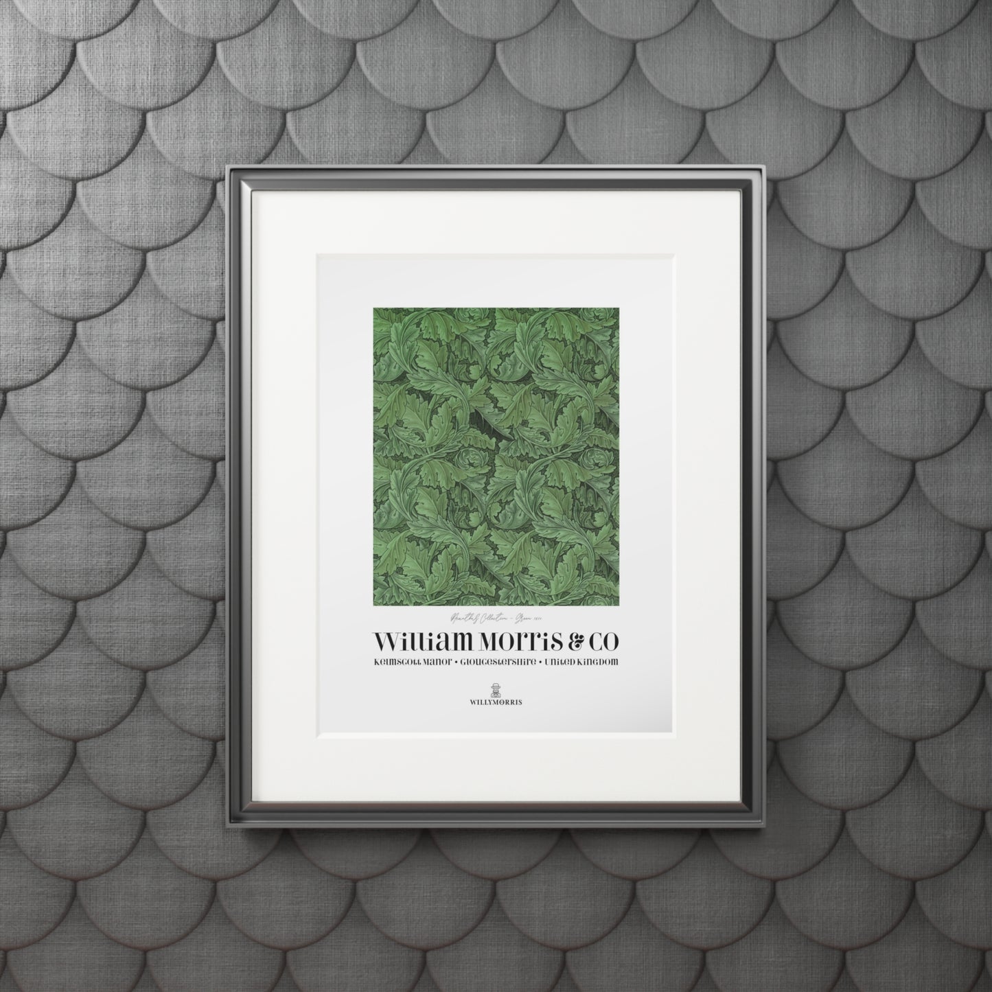 Framed artwork with green pattern and 'William Morris & Co' text on a textured gray wall.
