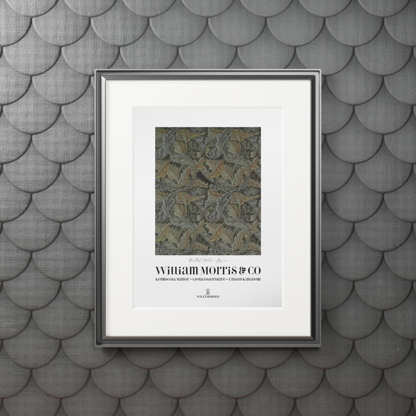 Framed artwork with text on a textured gray wall