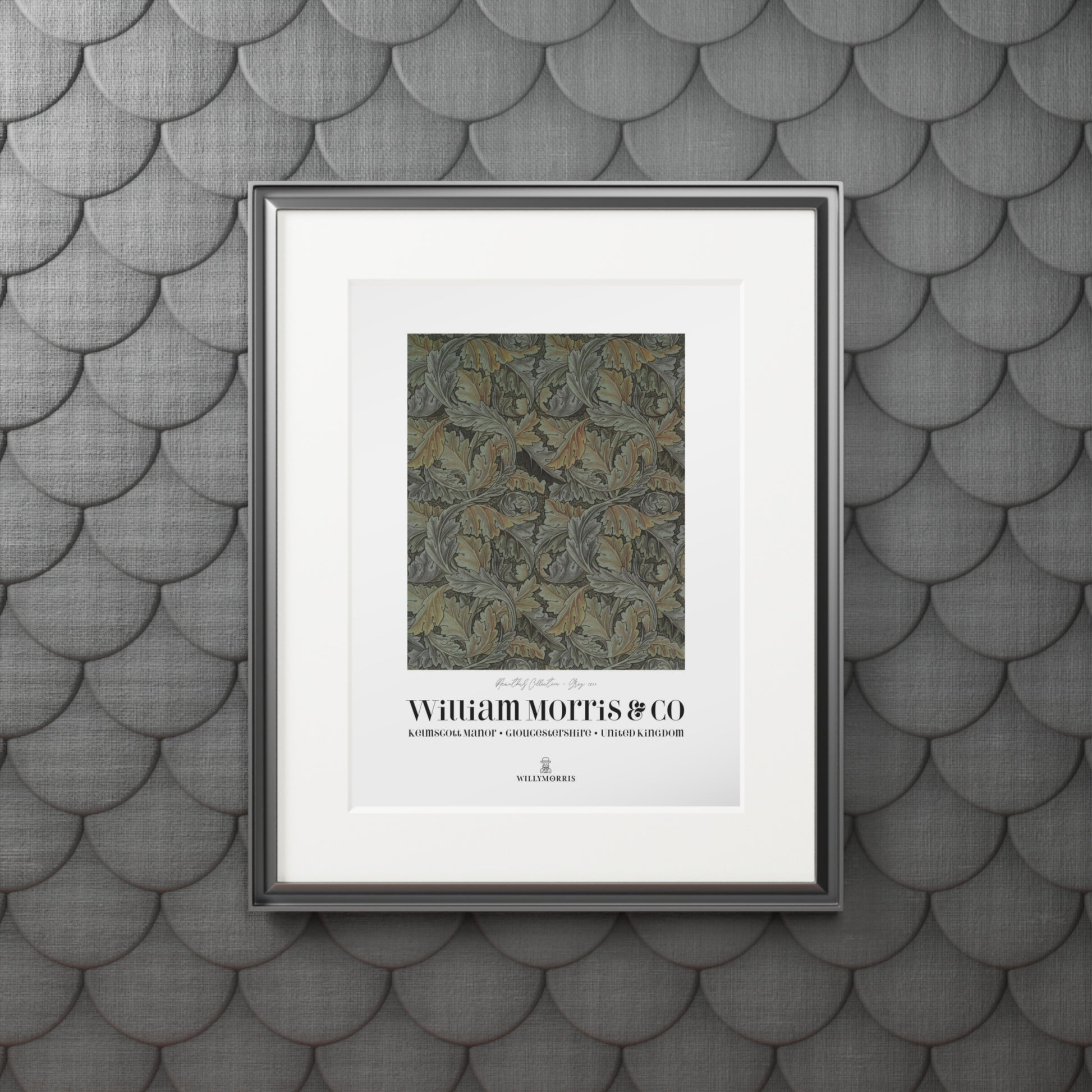Framed artwork with text on a textured gray wall