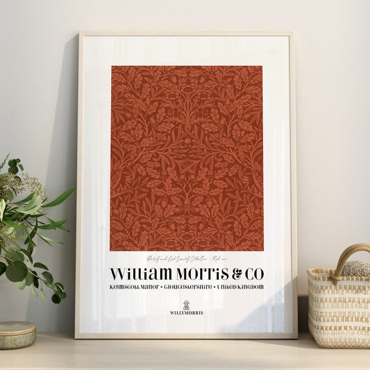 Framed William Morris & Co print with decorative pattern on a wall.