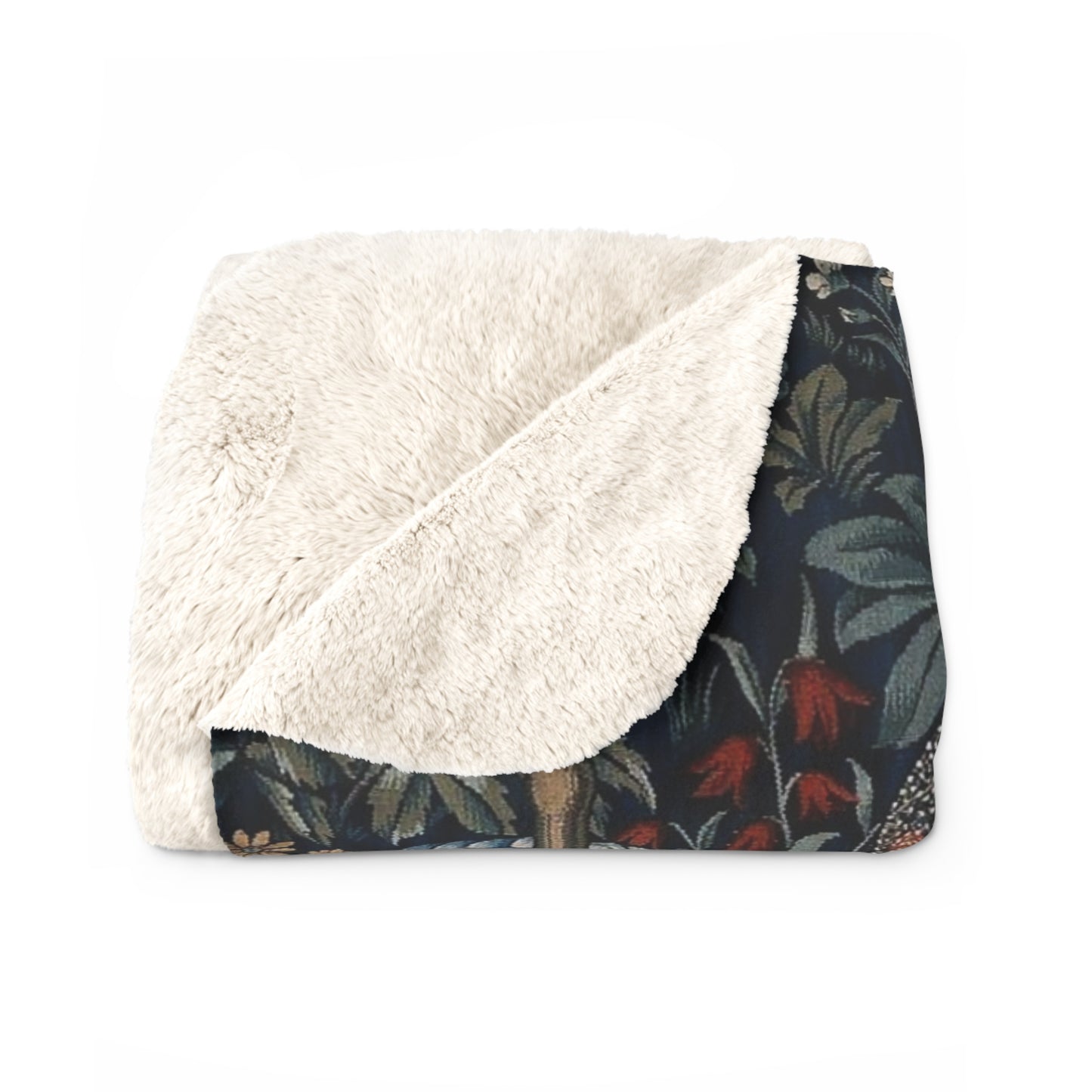 A Sherpa fleece blanket with a floral and angelic pattern inspired by William Morris' work.