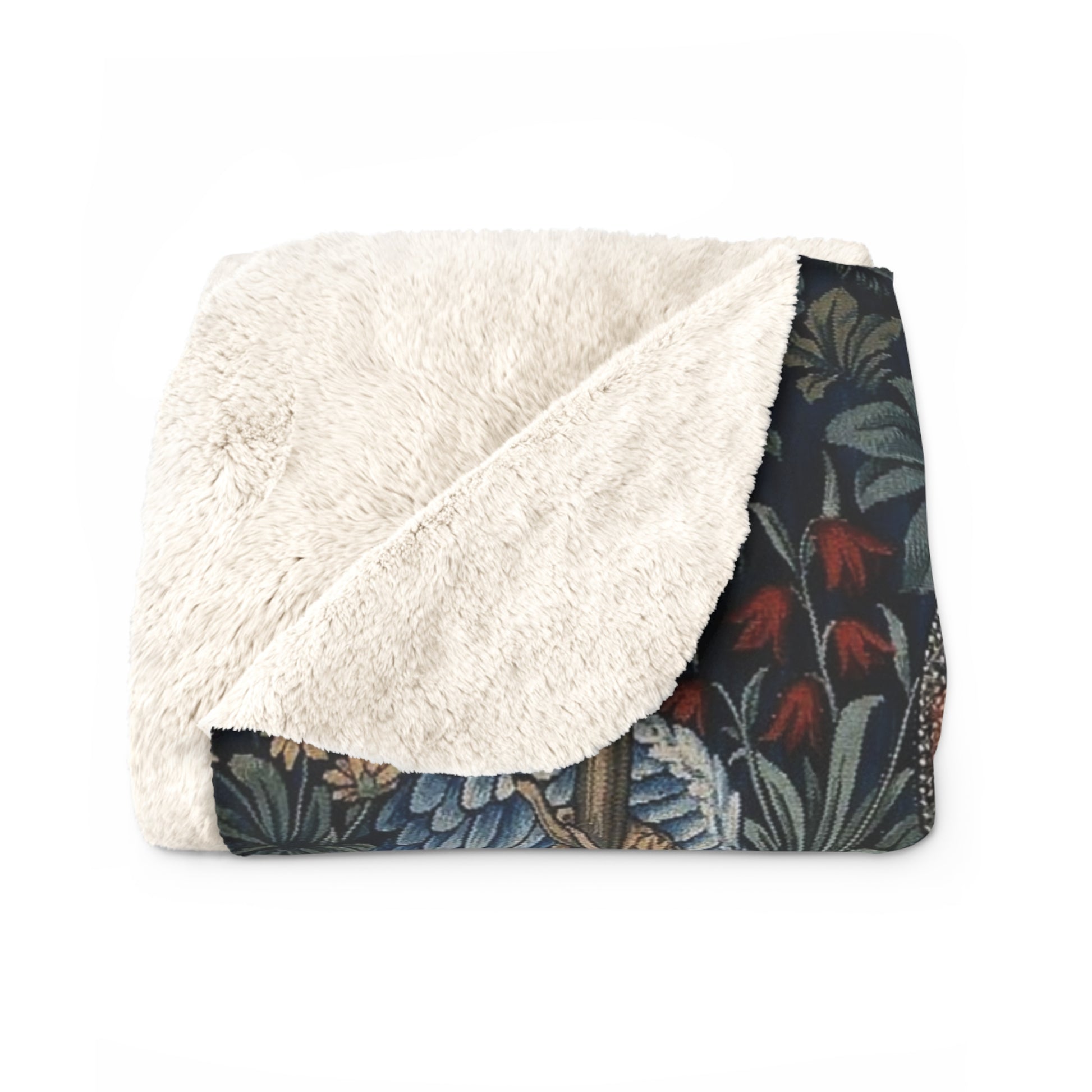 A Sherpa fleece blanket with a floral and angelic pattern inspired by William Morris' work.