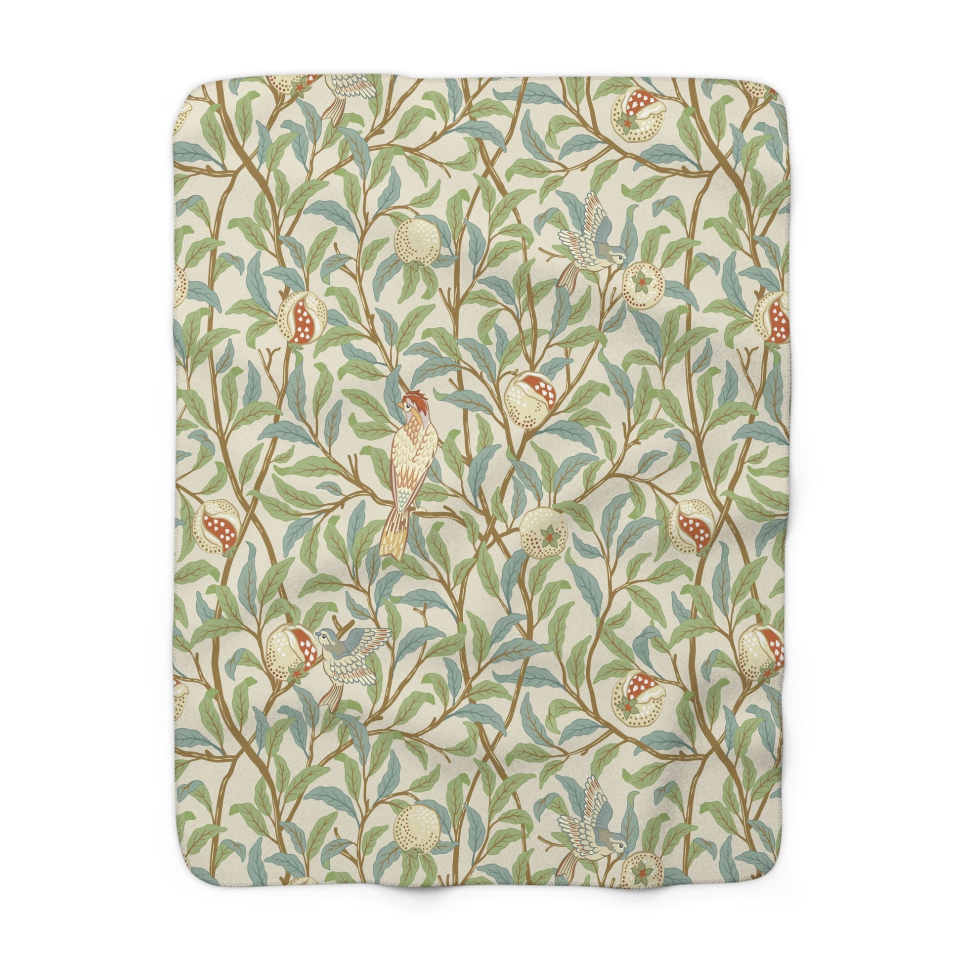 A plush fleece blanket with a floral William Morris & Co pattern featuring birds and pomegranates, predominantly in green tones.