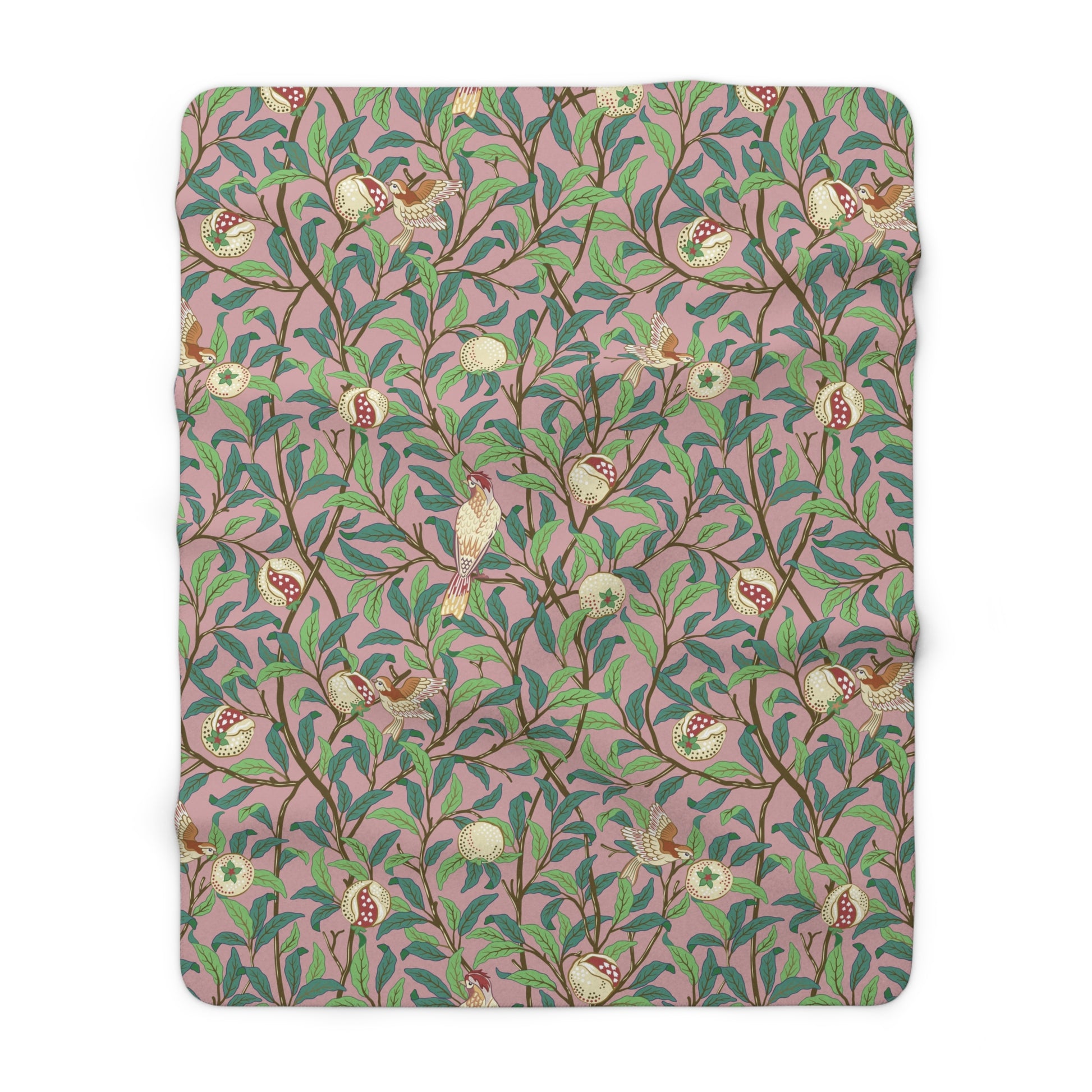 A plush fleece blanket with a floral William Morris & Co pattern featuring birds and pomegranate designs, predominantly in green and pink tones.