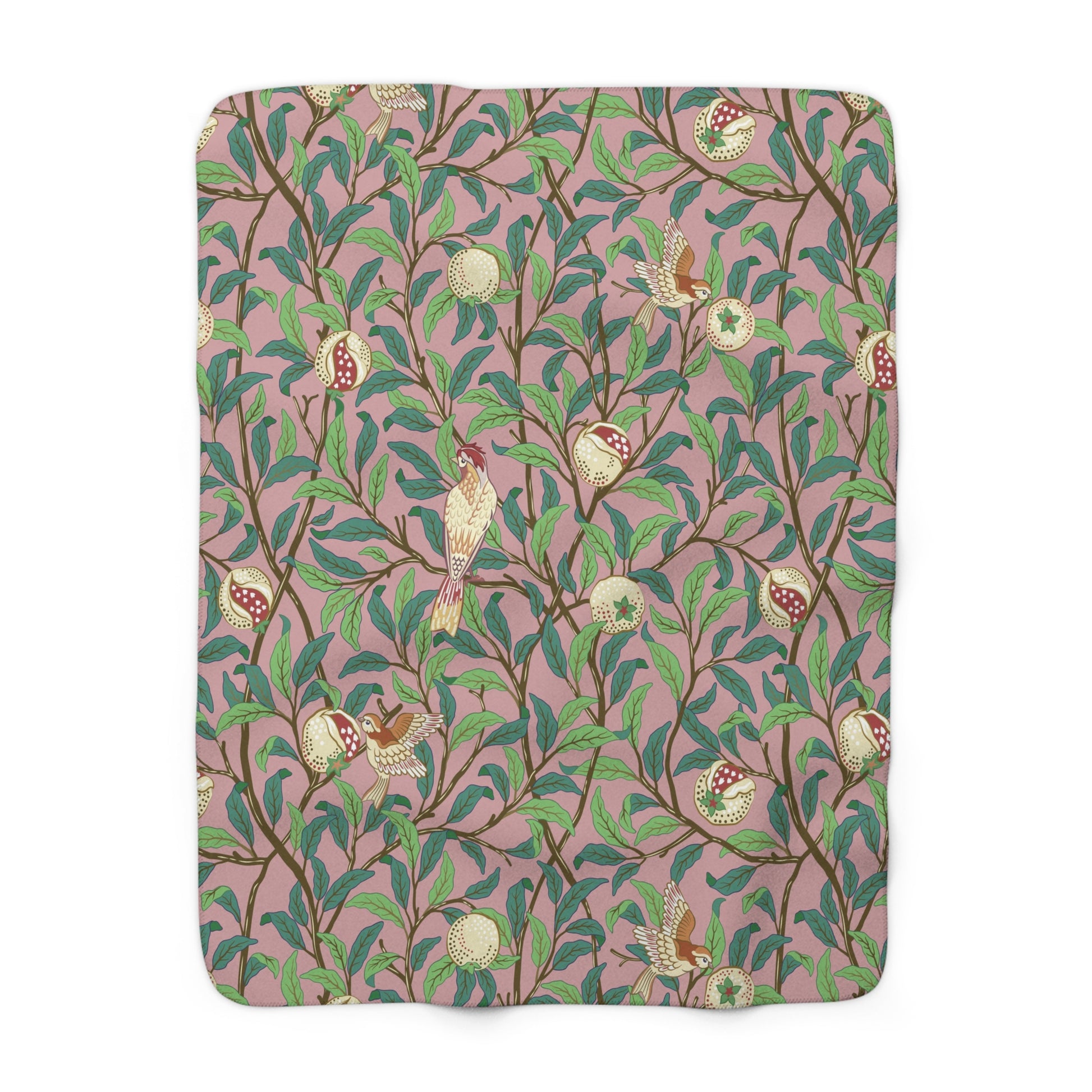 A plush fleece blanket with a floral William Morris & Co pattern featuring birds and pomegranate designs, predominantly in green and pink tones.