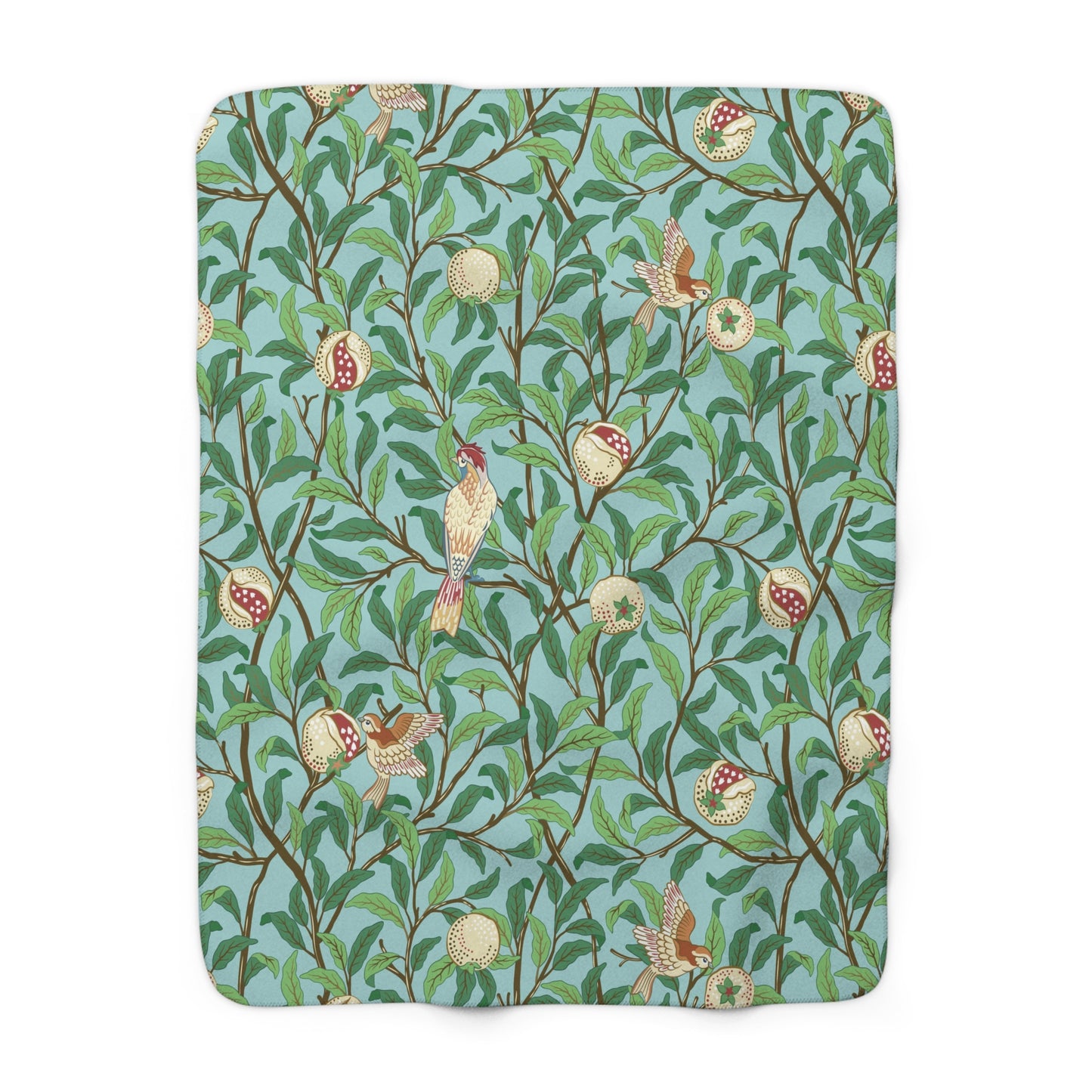 A Sherpa fleece blanket with an all-over print of birds and pomegranate fruits inspired by William Morris & Co on a blue background.