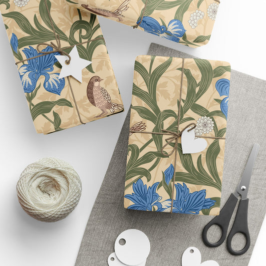 Gifts wrapped in decorative wrapping paper with William Morris & Co floral patterns, placed on a table alongside a roll of paper, scissors, and tags.