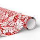 Roll of red and white patterned vinyl wrap on a white background