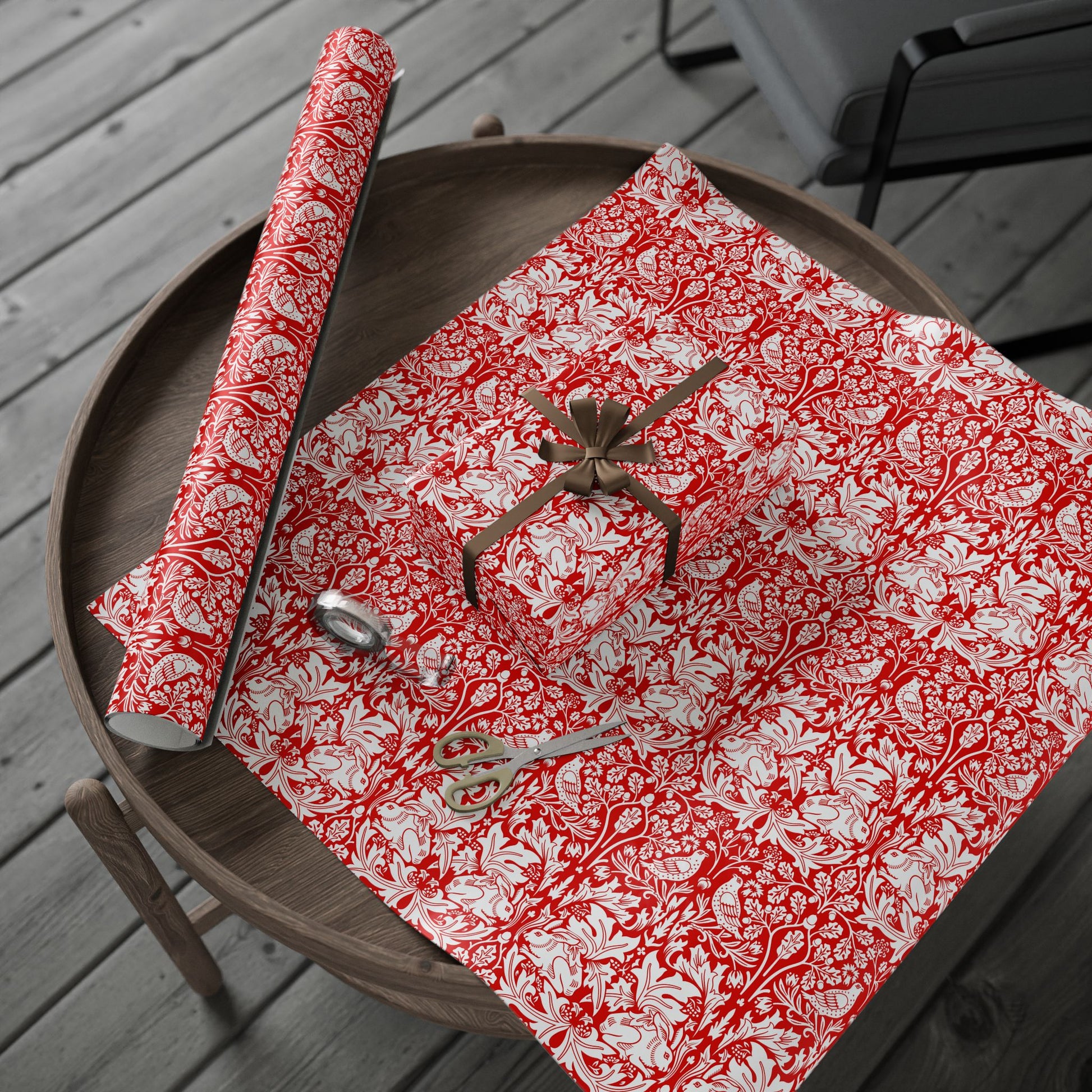 Red and white patterned paper with a spider on a wooden surface